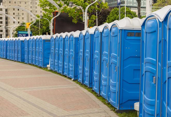 a row of portable restrooms at a fairground, offering visitors a clean and hassle-free experience in San Luis